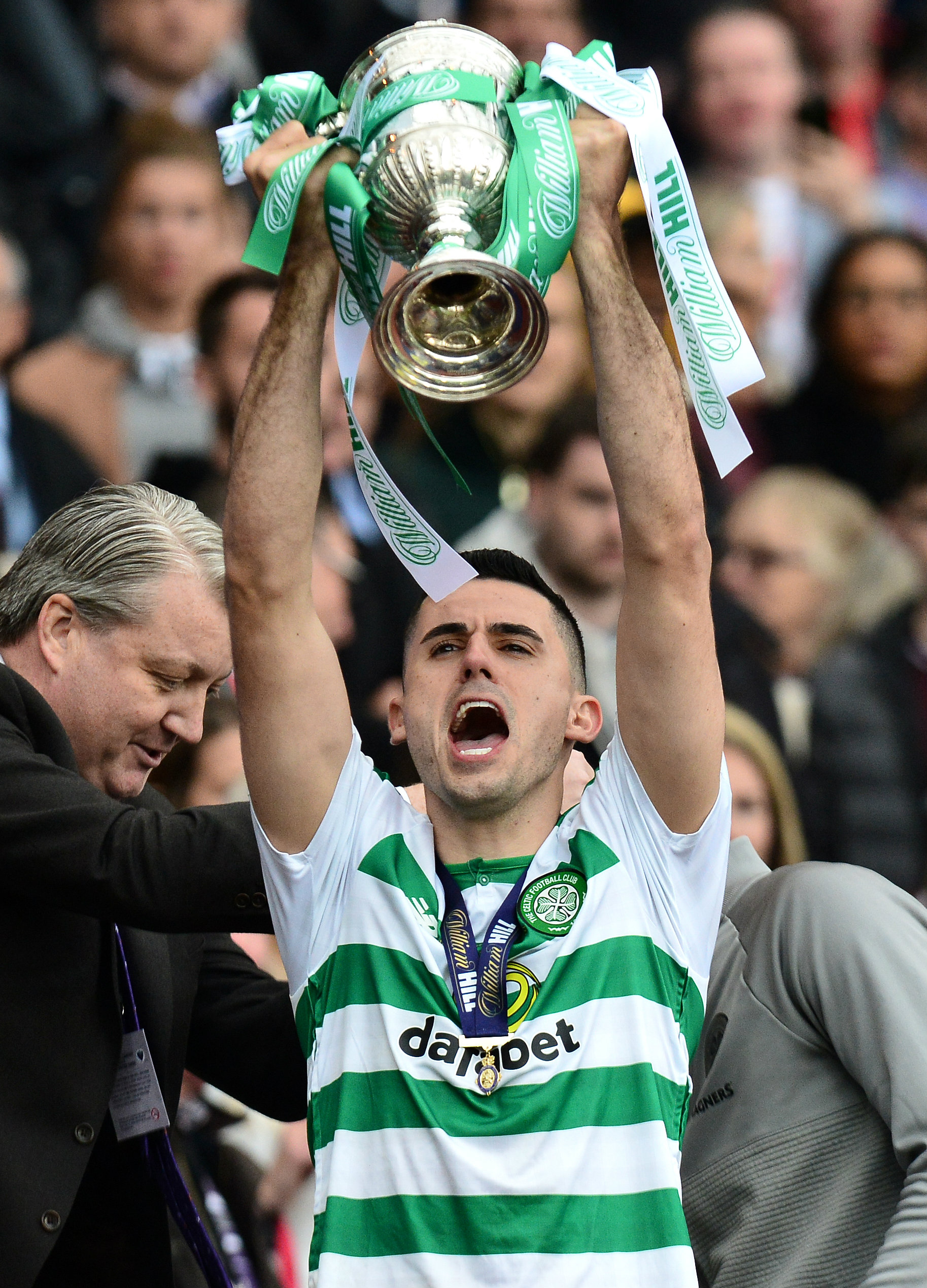 Tom Rogic lifts the Scottish Cup trophy