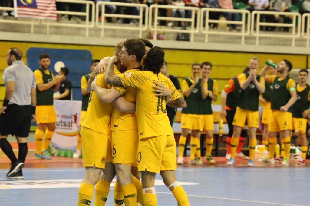 The Futsalroos celebrate a goal against Malaysia