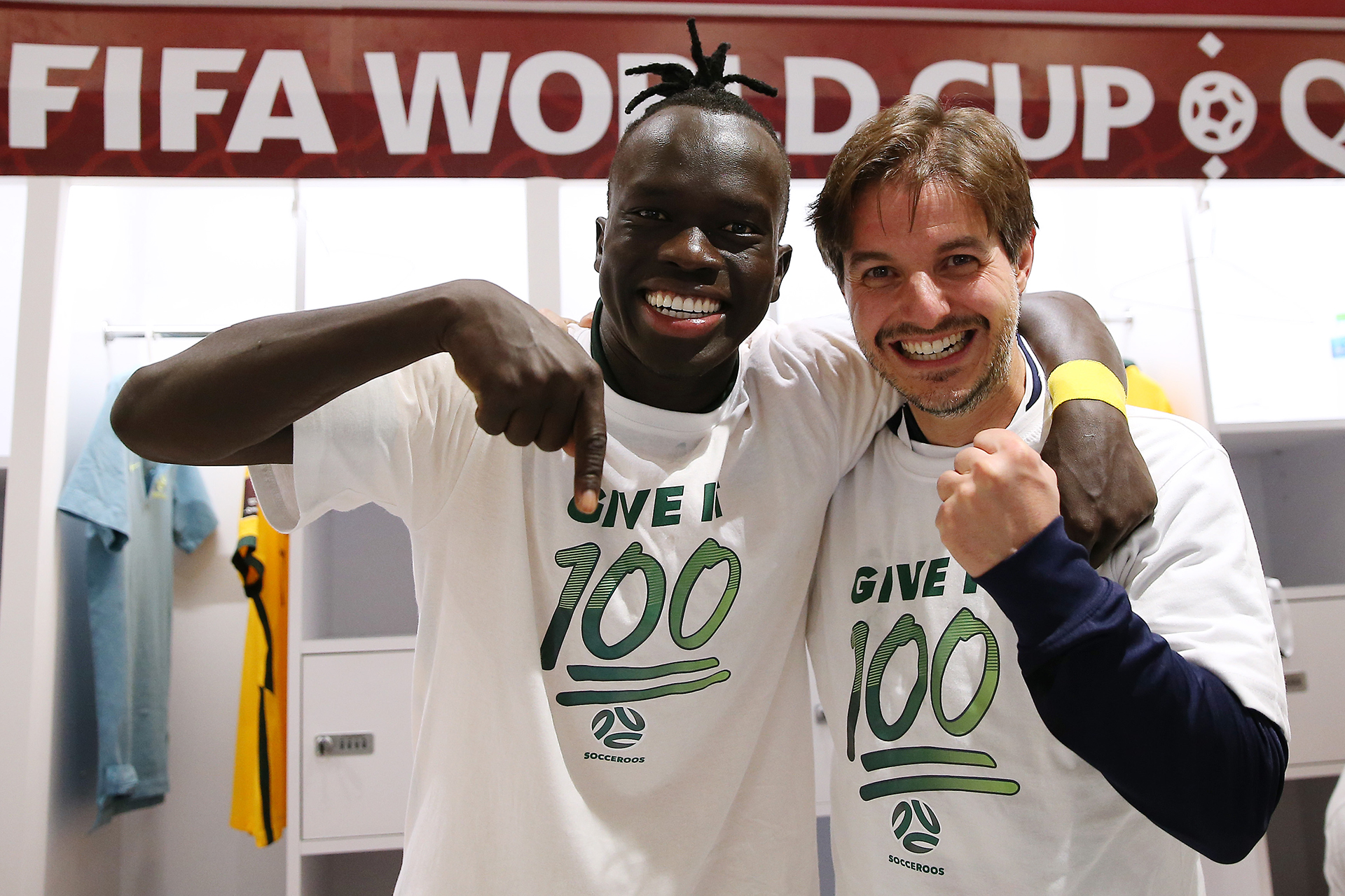 Awer Mabil celebrates in the changeroom after the Socceroos World Cup playoff triumph