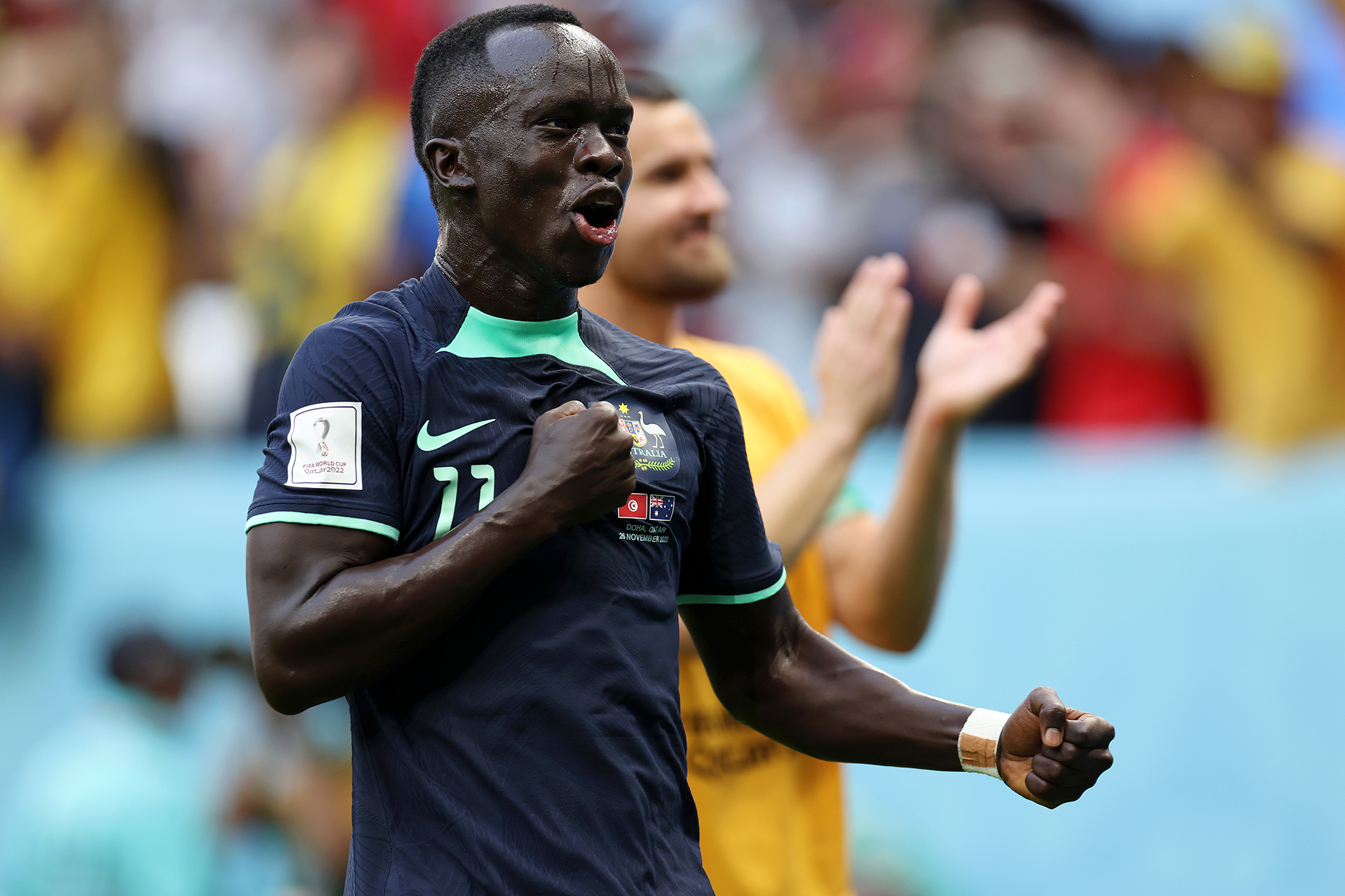 Awer Mabil celebrates after the Socceroos defeated Tunisia at the FIFA World Cup Qatar 2022