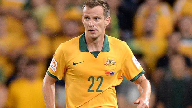 Alex Wilkinson returns to the Socceroos fold in place of the injured Matthew Spiranovic.