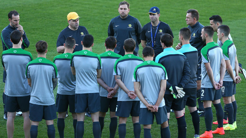 Peter Cklamovski (centre) alongside Ange Postecoglou during a Socceroos training session at Central Coast Stadium.