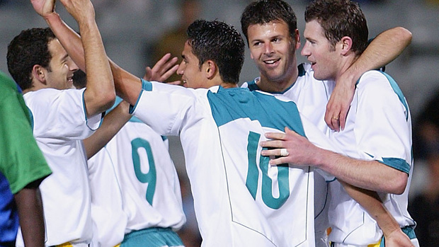 Socceroos players celebrate Tim Cahill's goal against the Solomon Islands.