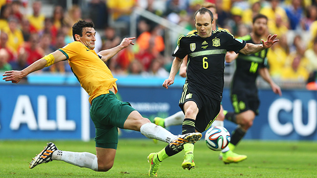 Jedinak challenges Andres Iniesta during Australia's 3-0 loss to Spain.