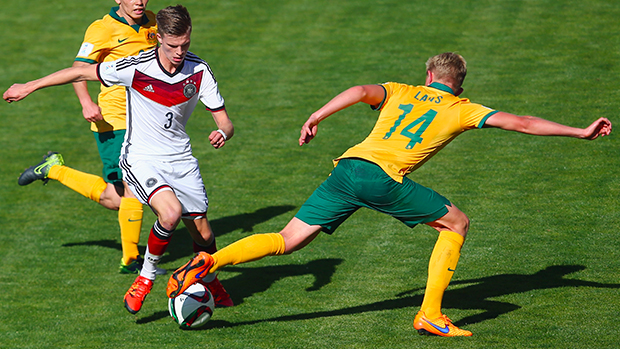 Josh Laws makes a tackle against Germany