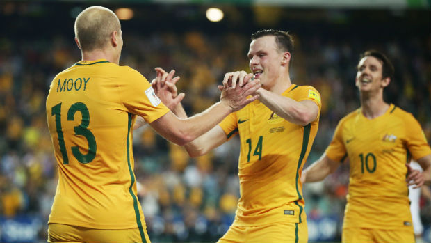 Caltex Socceroos Aaron Mooy and Brad Smith celebrate a goal scored against Jordan in Sydney.