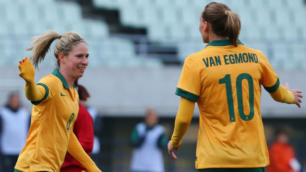 Westfield Matildas Elise Kellond-Knight and Emily van Egmond celebrate a goal in Rio Games qualification.