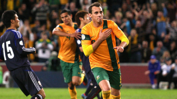 Luke Wilkshire celebrates scoring for the Socceroos against Japan at Brisbane Stadium in 2012.