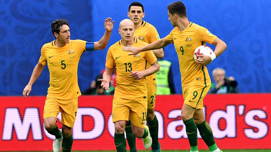 Caltex Socceroos players celebrate the equaliser.