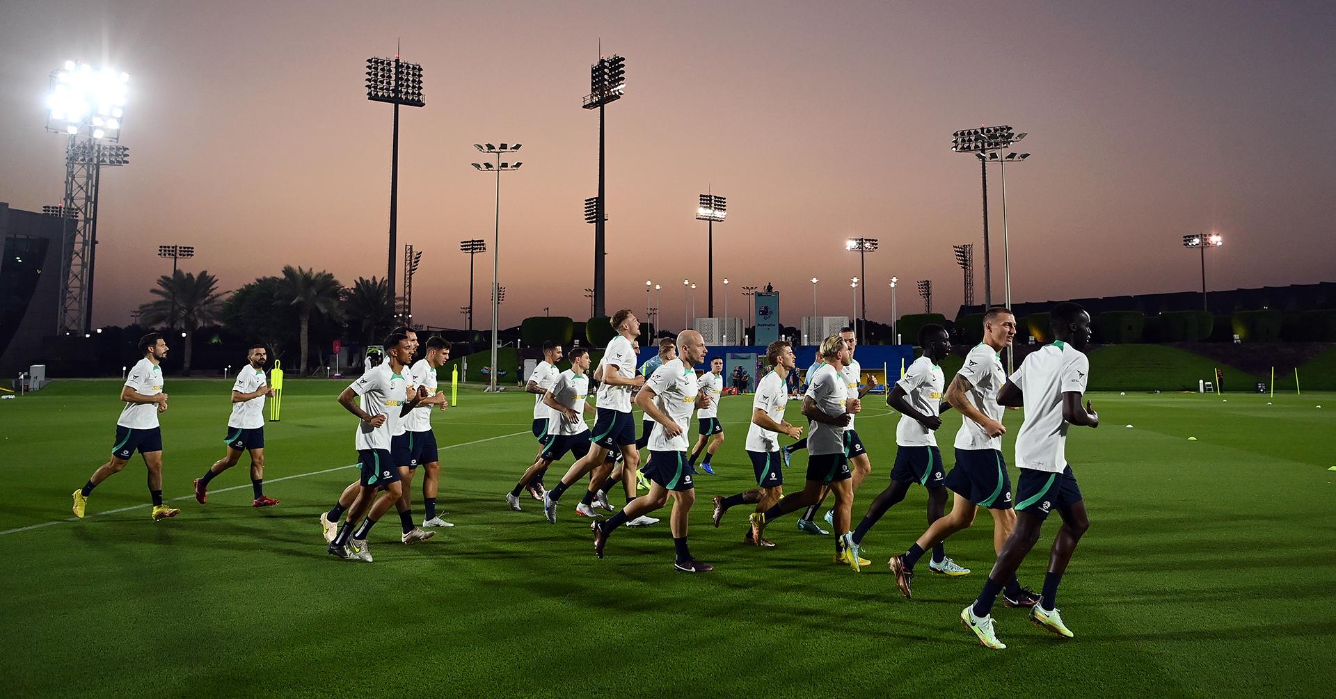 The Socceroos warm up at training in Qatar at the FIFA World Cup