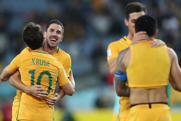 The Caltex Socceroos celebrate after the win over Syria in Sydney.