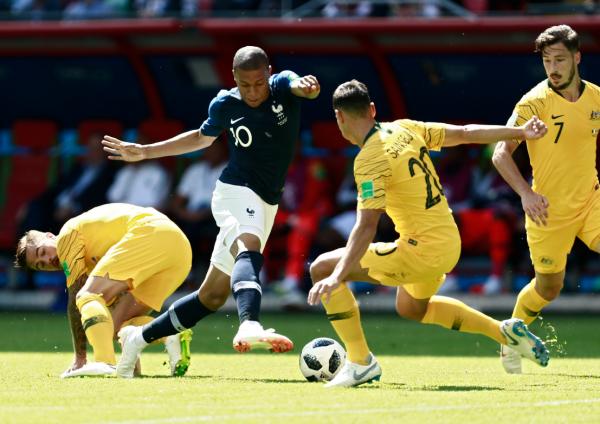 Trent Sainsbury tackles Kylian Mbappé at the 2018 World Cup
