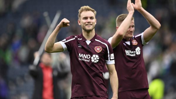 Nathaniel Atkinson celebrates after Hearts booked a place in the Scottish Cup Final