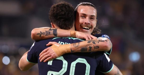 Jackson Irvine hugs John Iredale after the young striker scored his first Socceroos goal
