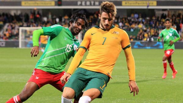 Socceroo Mathew Leckie shields possession against Bangladesh in Perth.
