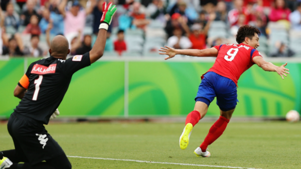 Korea Republic's Cho Young Cheol celebrates scoring the winner against Oman.