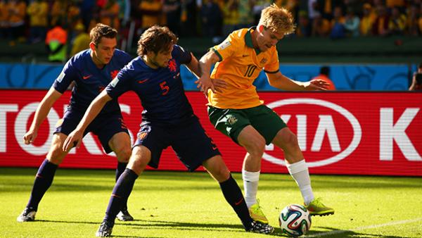 Halloran competes for the ball with Holland's Daley Blind.