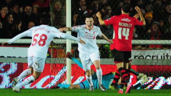 Liverpool left-back Brad Smith celebrates scoring against Exeter City in the FA Cup.