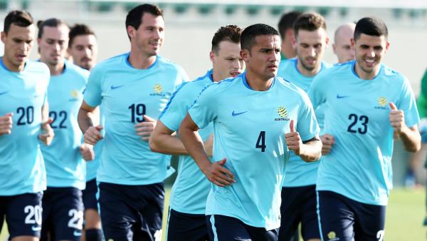 Tim Cahill leads the Caltex Socceroos on a lap during training.