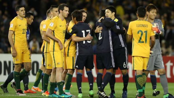 The Caltex Socceroos and Japan players shake  hands following their WCQ in Melbourne.