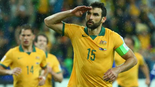 Caltex Socceroos skipper Mile Jedinak salutes Aussie supporters after scoring.