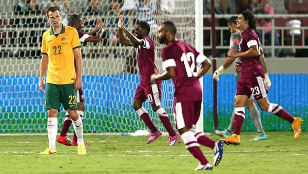 Qatar celebrate scoring the only goal of the game against the Socceroos.