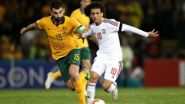 Socceroos skipper Mile Jedinak fights for the ball with UAE superstar Omar Abdulrahman.