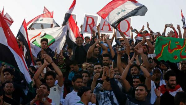 Iraq fans support their team during a World Cup Qualifier at Shahid Dastgerdi Stadium.