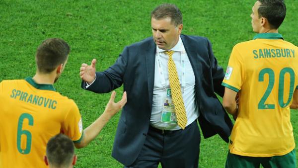 Postecoglou congratulates Socceroo defender Matt Spiranovic after Australia's 4-1 win over Kuwait.