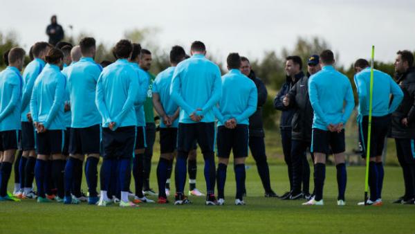 The Caltex Socceroos receives instructions from coach Ange Postecoglou at their training camp in Sunderland.
