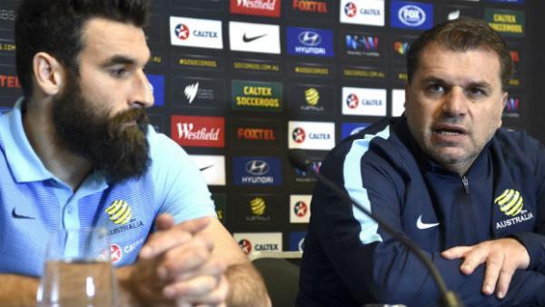 Caltex Socceroos captain Mile Jedinak and coach Ange Postecoglou at Monday's press conference in Sydney.