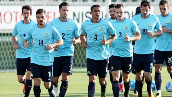 The Caltex Socceroos are put through a warm-up during a training session in Japan.