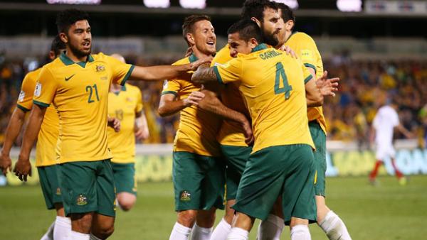 Socceroos players celebrate Mile Jedinak's opener against Kyrgyzstan in Canberra.