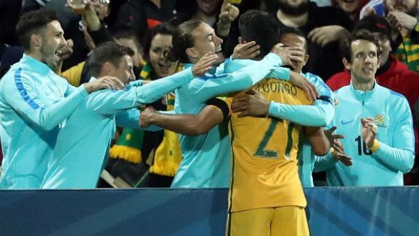 The Caltex Socceroos celebrate Mass Luongo's opener against Iraq.