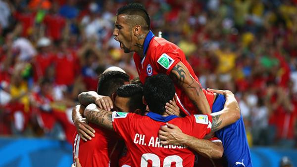 Arturo Vidal celebrates with his Chilean team mates after a goal against Australia.
