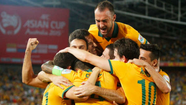 The Socceroos celebrate Matt McKay's opening goal against Oman.