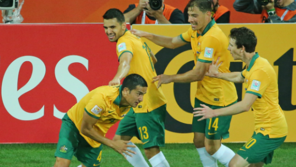 Tim Cahill celebrates his equaliser against Kuwait with Socceroo teammates.