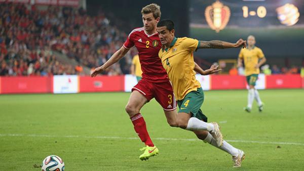 Tim Cahill wins the ball from Belgium's Toby Alderweireld.