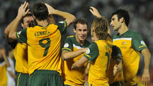The Socceroos celebrate Josh Kennedy scoring against Saudi Arabia in 2011.