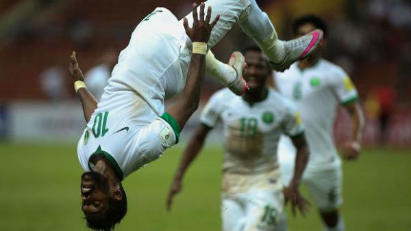 Saudi Arabia's Nawaf Alabid celebrates scoring a penalty against Iraq in their World Cup qualifier.
