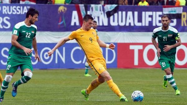 Striker Tomi Juric gets a pass away during the 1-1 draw with Iraq in Tehran.