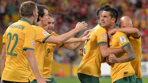 Socceroos players celebrate Tim Cahill's goal against China in the Asian Cup quarter final.