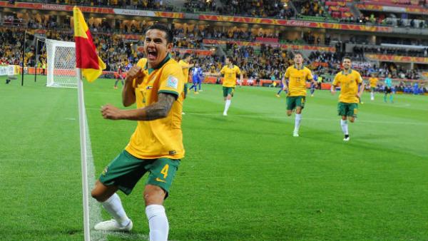 Tim Cahill performs his trademark goal celebration after scoring against Kuwait.