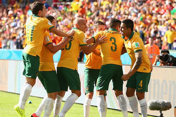 Socceroo Tim Cahill celebrates his incredible strike against the Netherlands with teammates.