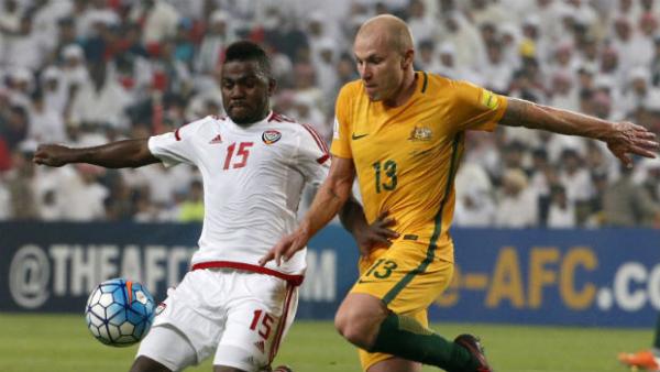 Midfielder Aaron Mooy challenges for the ball against UAE.