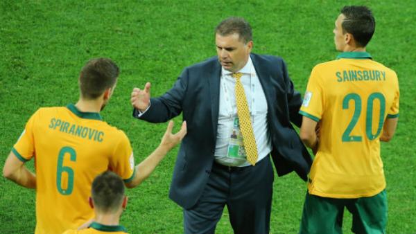 Socceroos coach Ange Postecoglu congratulates his players at full-time against Kuwait.