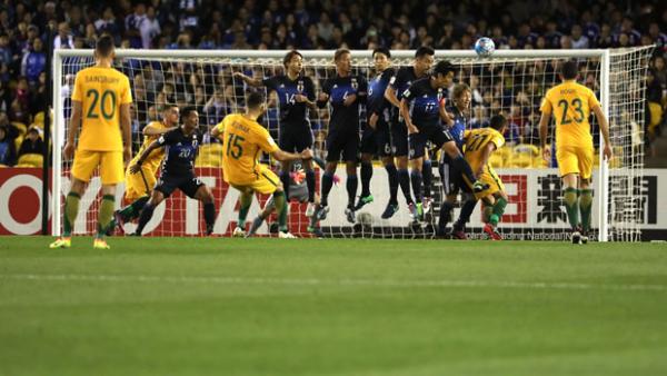 Mile Jedinak fires a free kick on target during the Caltex Socceroos' 1-1 draw with Japan.