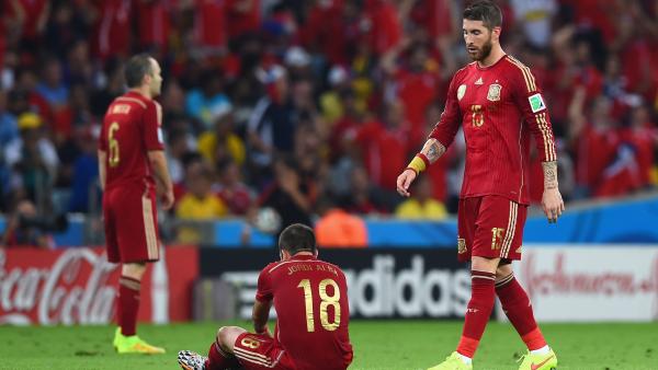 Spanish players look on following their World Cup loss to Chile.