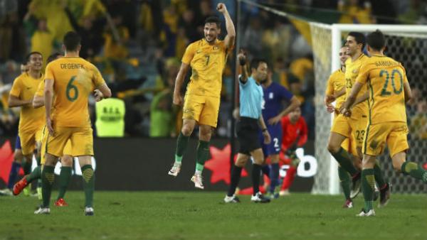 Caltex Socceroos forward Mathew Leckie celebrates scoring against Greece.
