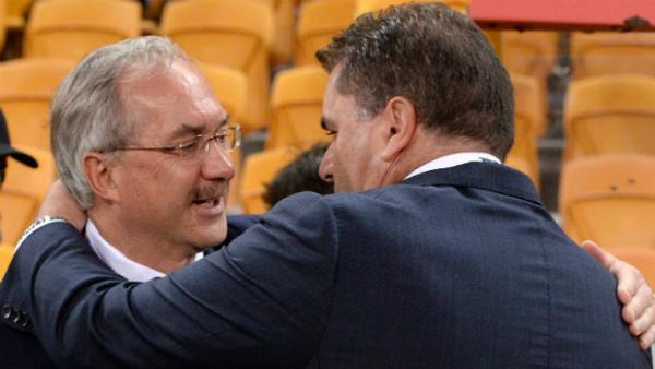Ulrich Stielike and Ange Postecoglou wish each other good luck before kick-off.